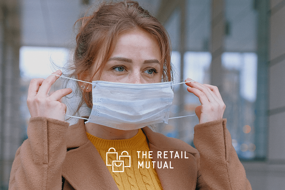 Woman covering her face with a mask